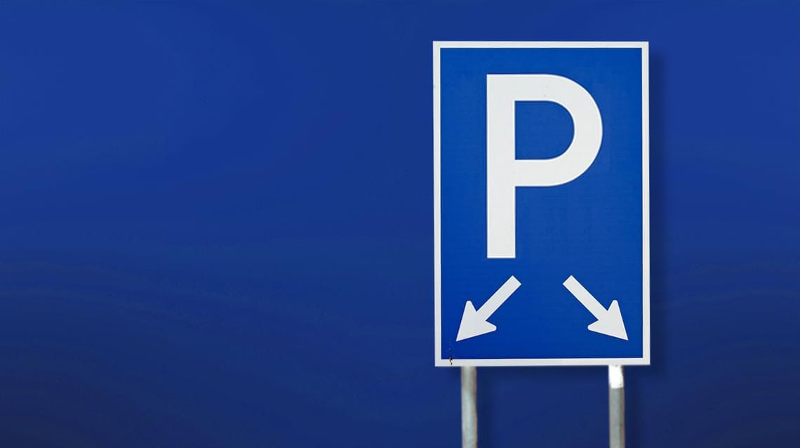 A parking sign on a blue gradient background