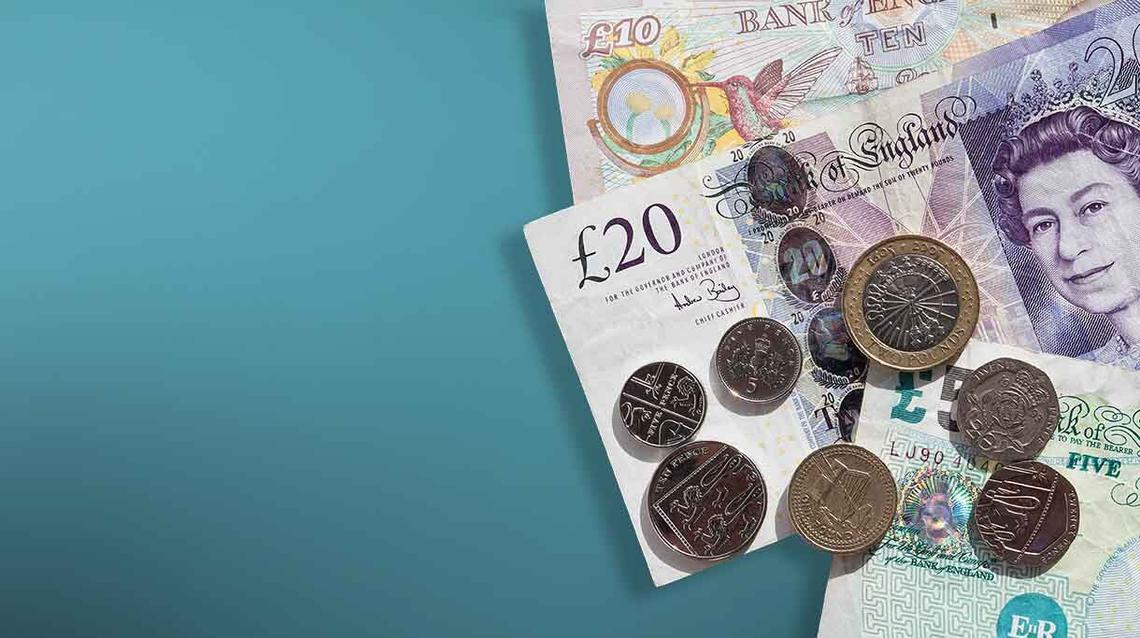 A pile of cash on a teal gradient background