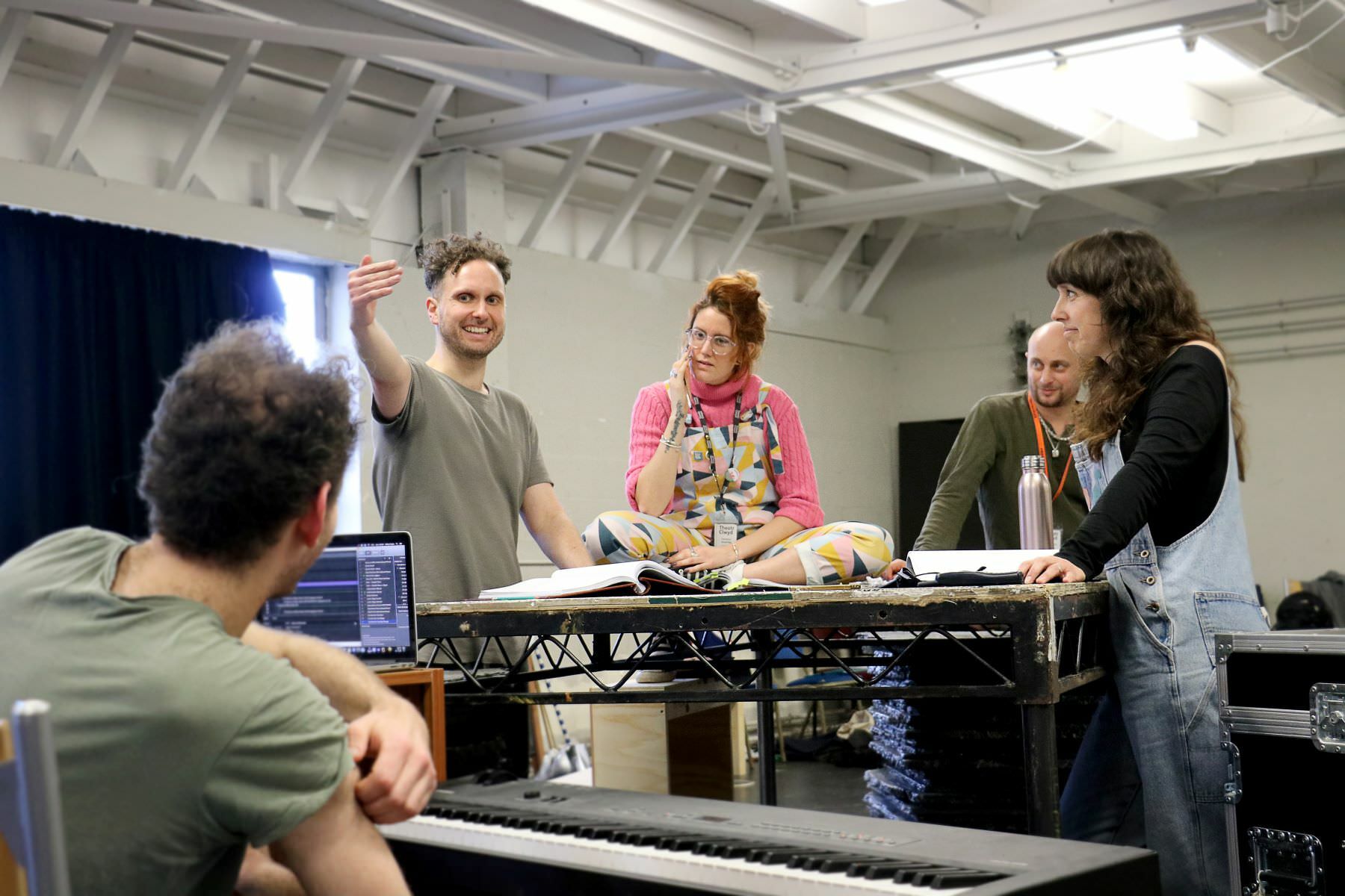 Group of 5 creative directors gathered in a rehearsal room