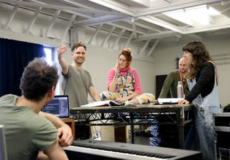 Group of 5 creative directors gathered in a rehearsal room