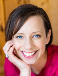 Headshot of Zoe Crick-Tucker. White woman with short brown hair.